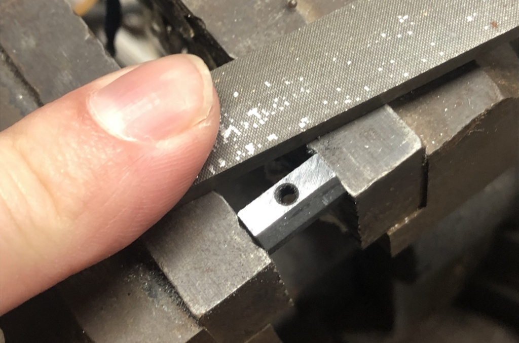 Dressing down the contact part of the optic rail mounting tab will raise it, removing slop in the system. Go slowly and make sure you keep it dead flat. Using a caliper will help you measure how much material you’re taking if: a few file passes and some cleanup with 320 sandpaper removed about .002”.