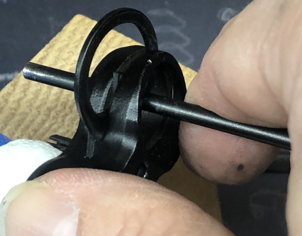 The factory front sight can be tough to remove. Use the shaft of a punch against the front sight post to rotate the ring/sight assembly out of the sight base.