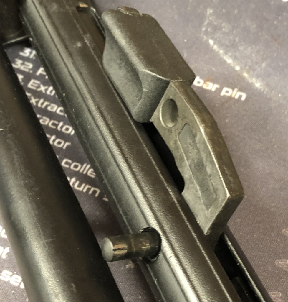 The bottom of the pin is both larger and splined. It may take some force to get it moving, but once that part clears the hole it's easy.