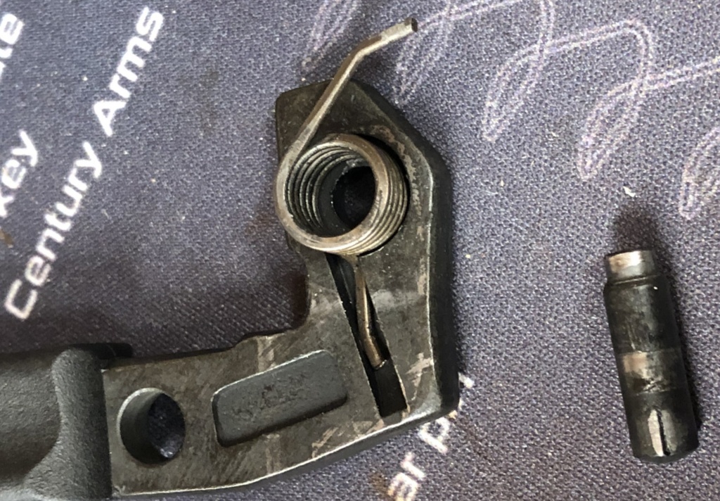 The spring has a curved tail that holds it in place in the handle, which makes reassembly much easier. It’ll take some force—and perhaps the end of a screwdriver—to force it into place.