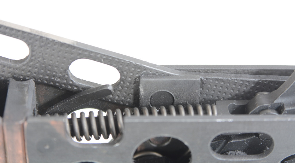 Two important things to know about the trigger housing: the leg on the left side that releases the selector lever and the pin that holds in the ejector, the waffle-stamped piece with two slots. It pushes out easily from the right side, the view that’s shown here. Note the hammer is in the forward position.